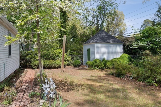 24 Holly Dr, Newport News, VA 23601 - view of yard with fence, an outbuilding, and a storage unit
