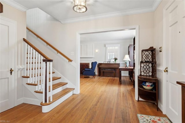 24 Holly Dr, Newport News, VA 23601 - entryway featuring wood finished floors, stairs, and ornamental molding