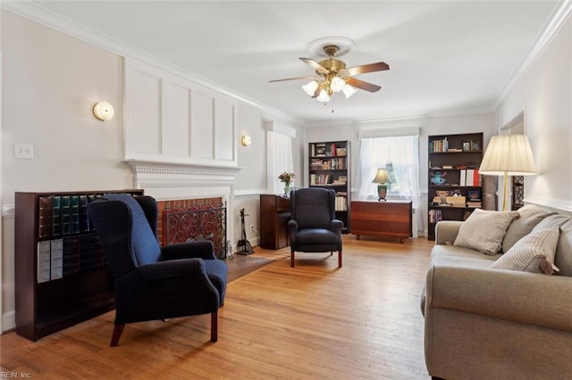 24 Holly Dr, Newport News, VA 23601 - living room featuring ceiling fan, ornamental molding, and light wood-type flooring