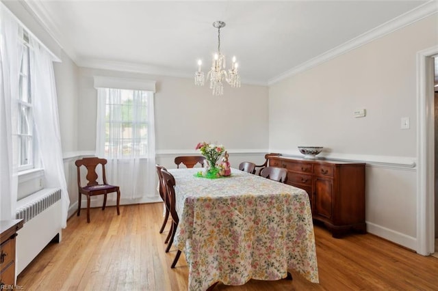 24 Holly Dr, Newport News, VA 23601 - dining room featuring crown molding, radiator heating unit, a chandelier, and light wood finished floors