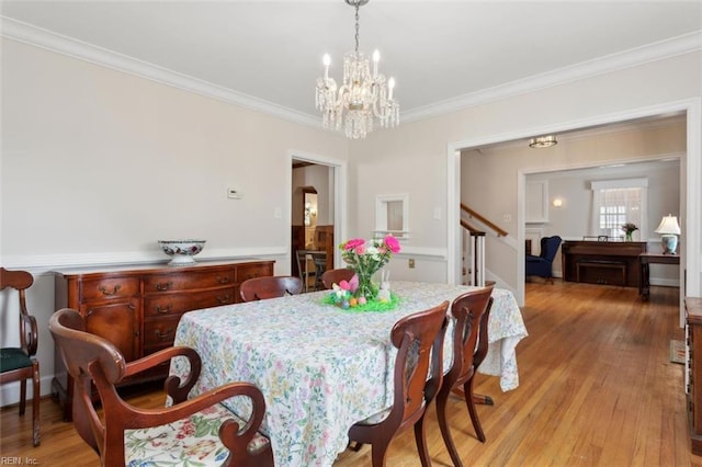 24 Holly Dr, Newport News, VA 23601 - dining area featuring a chandelier, light wood-style floors, stairway, and crown molding