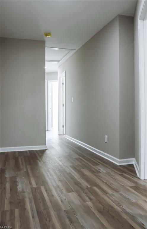 404 Hogart St, Franklin, VA 23851 - empty room featuring wood finished floors and baseboards