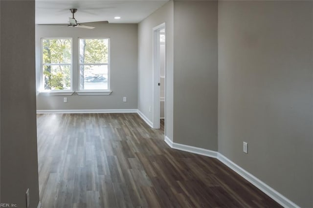 404 Hogart St, Franklin, VA 23851 - unfurnished room with a ceiling fan, baseboards, and dark wood-style floors