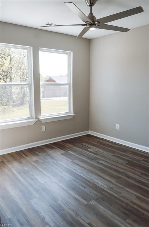 404 Hogart St, Franklin, VA 23851 - empty room with plenty of natural light, a ceiling fan, and baseboards