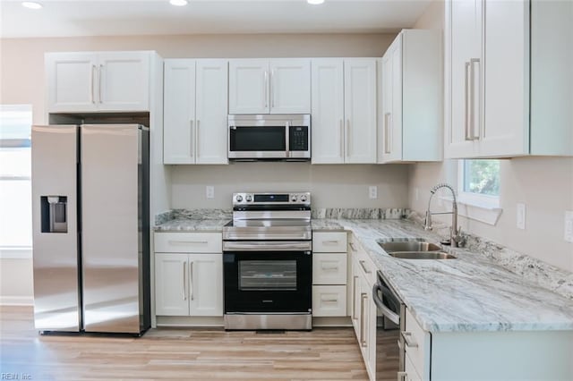 404 Hogart St, Franklin, VA 23851 - kitchen with recessed lighting, appliances with stainless steel finishes, white cabinetry, and a sink