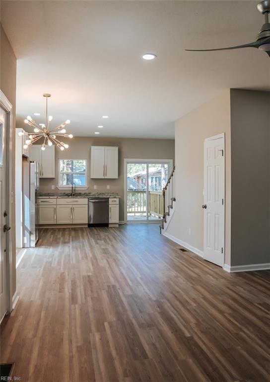 404 Hogart St, Franklin, VA 23851 - unfurnished living room with plenty of natural light and dark wood-style floors