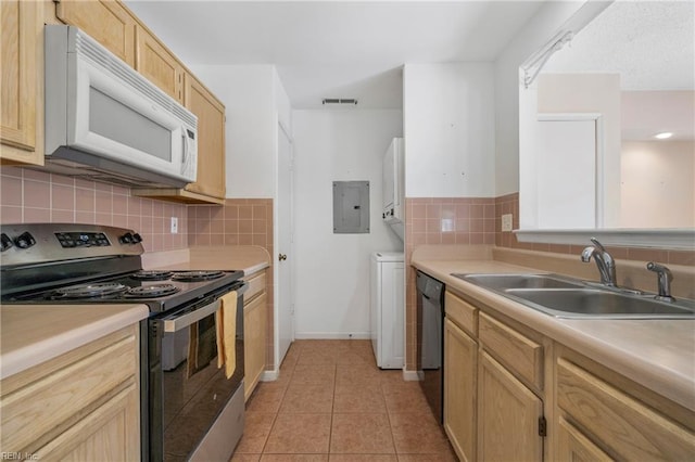 5201 Bardith Cir, Virginia Beach, VA 23455 - kitchen with white microwave, stainless steel electric range, a sink, black dishwasher, and light tile patterned floors