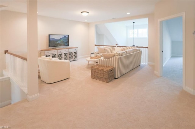 living room featuring baseboards, recessed lighting, and carpet