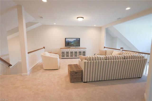 carpeted living area with recessed lighting and lofted ceiling