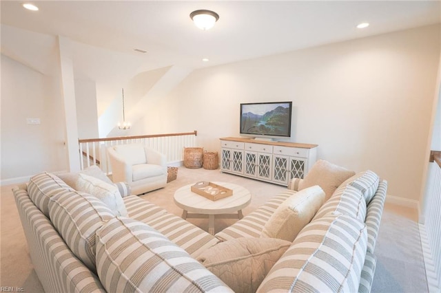 living room featuring recessed lighting, carpet, baseboards, and a notable chandelier