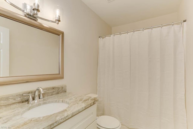 full bathroom with toilet, vanity, and a shower with shower curtain