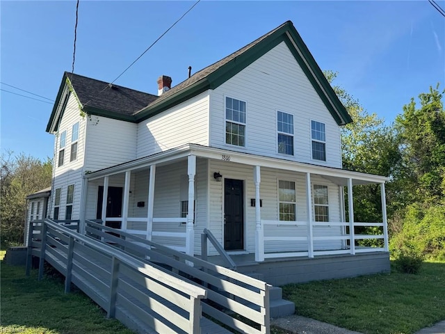 3800 Victoria Blvd, Hampton, VA 23669 - farmhouse-style home with a porch, a shingled roof, a front lawn, and a chimney