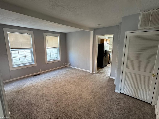 3800 Victoria Blvd, Hampton, VA 23669 - empty room featuring baseboards, a textured ceiling, visible vents, and carpet