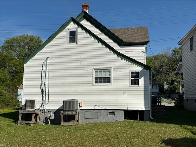 3800 Victoria Blvd, Hampton, VA 23669 - back of house featuring a yard, roof with shingles, and central AC unit