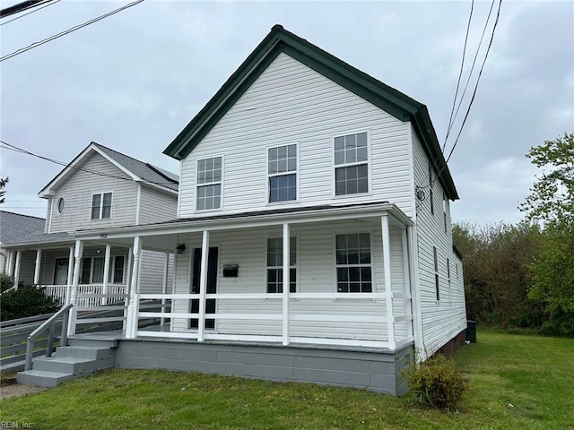 3800 Victoria Blvd, Hampton, VA 23669 - farmhouse-style home with a front lawn and covered porch