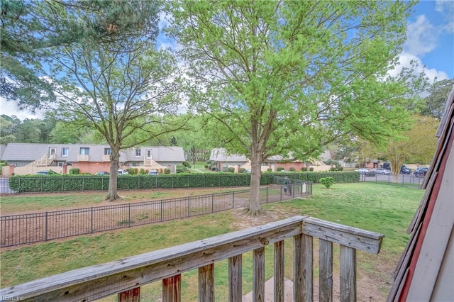 view of yard featuring a fenced backyard and a residential view