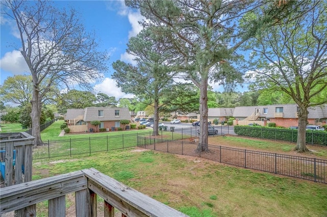 view of yard with a residential view and a fenced backyard