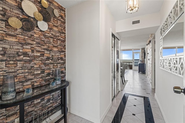 3300 Ocean Shore Ave Unit 503, Virginia Beach, VA 23451 - hallway with baseboards, visible vents, and light tile patterned floors