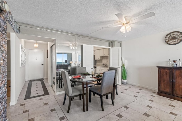 3300 Ocean Shore Ave Unit 503, Virginia Beach, VA 23451 - dining area featuring baseboards, a ceiling fan, a textured ceiling, and light tile patterned flooring