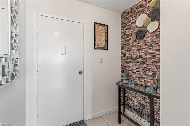 3300 Ocean Shore Ave Unit 503, Virginia Beach, VA 23451 - foyer entrance with baseboards, a textured ceiling, and light tile patterned flooring