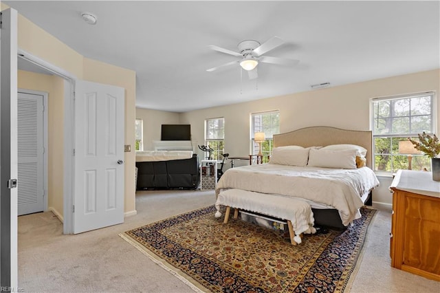 2064 Nicklaus Dr, Suffolk, VA 23435 - bedroom with baseboards, visible vents, multiple windows, and light colored carpet