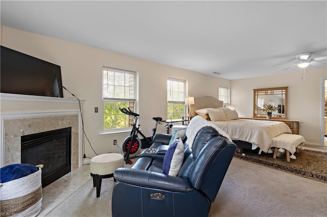 2064 Nicklaus Dr, Suffolk, VA 23435 - bedroom featuring light colored carpet, a high end fireplace, and multiple windows