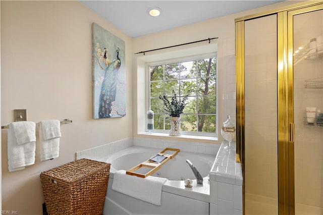 2064 Nicklaus Dr, Suffolk, VA 23435 - bathroom with a tub with jets, a wealth of natural light, and a stall shower