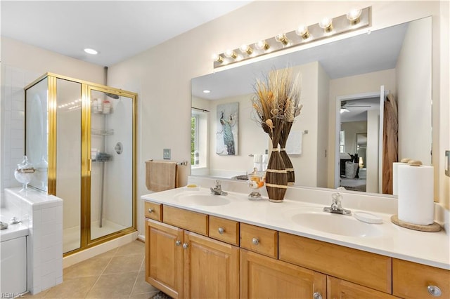 2064 Nicklaus Dr, Suffolk, VA 23435 - bathroom featuring double vanity, tile patterned flooring, a stall shower, and a sink