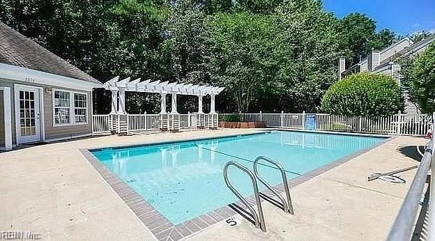 2064 Nicklaus Dr, Suffolk, VA 23435 - pool featuring fence, a pergola, and a patio area