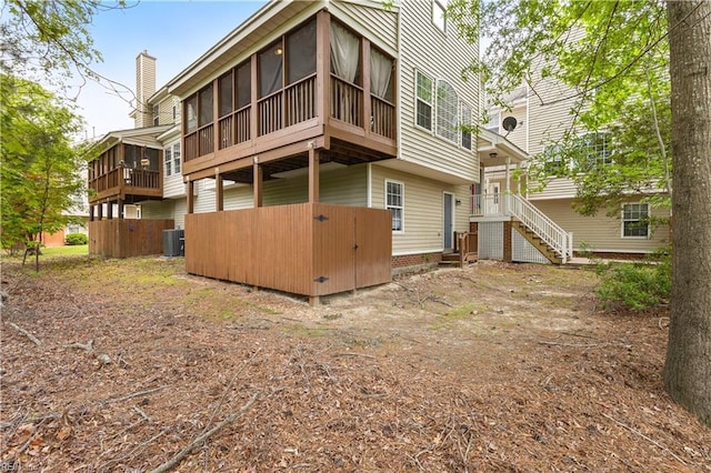 2064 Nicklaus Dr, Suffolk, VA 23435 - rear view of property with central AC and a sunroom