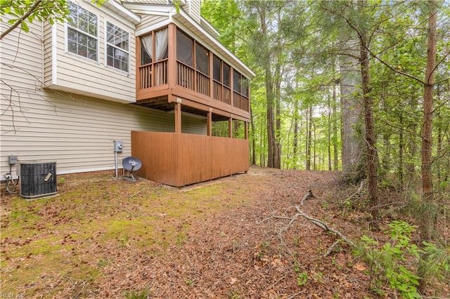2064 Nicklaus Dr, Suffolk, VA 23435 - rear view of house with cooling unit and a sunroom