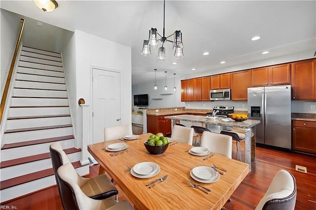 dining area with recessed lighting, stairway, and dark wood-type flooring