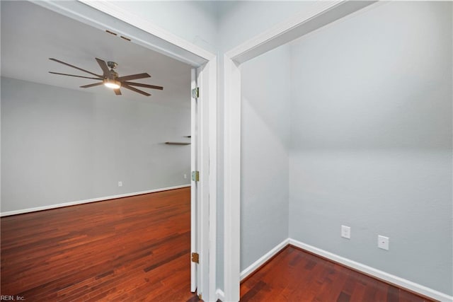bonus room with baseboards, wood finished floors, and ceiling fan