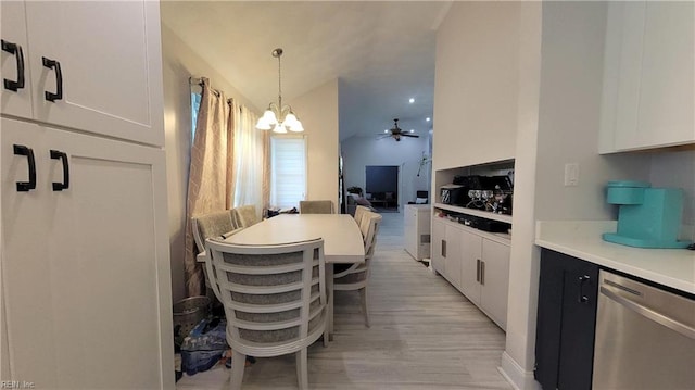 7045 Doummar Dr, Norfolk, VA 23518 - dining area with light wood-type flooring, lofted ceiling, and ceiling fan with notable chandelier