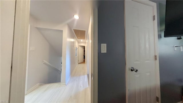 7045 Doummar Dr, Norfolk, VA 23518 - hallway with an upstairs landing, light wood-type flooring, and baseboards