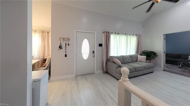 7045 Doummar Dr, Norfolk, VA 23518 - living area featuring a ceiling fan, light wood-type flooring, high vaulted ceiling, and baseboards