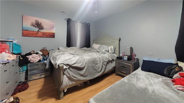 7045 Doummar Dr, Norfolk, VA 23518 - bedroom featuring light wood finished floors and vaulted ceiling