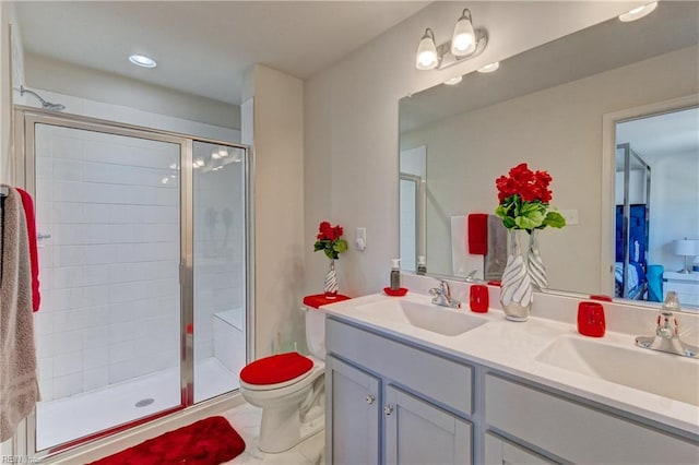 full bath with a sink, double vanity, and a stall shower