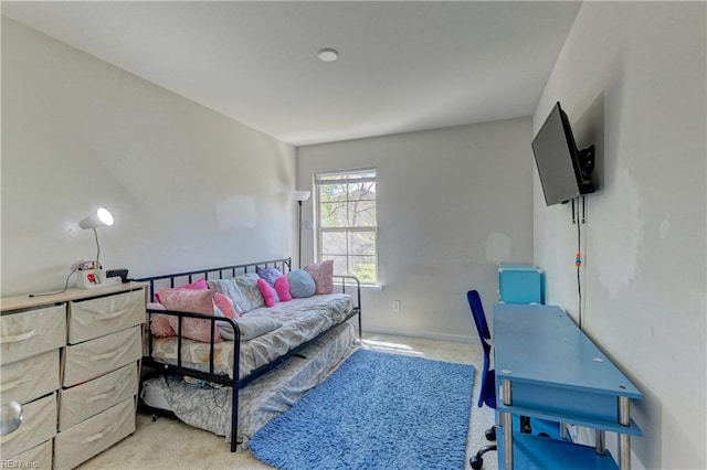 bedroom featuring light colored carpet