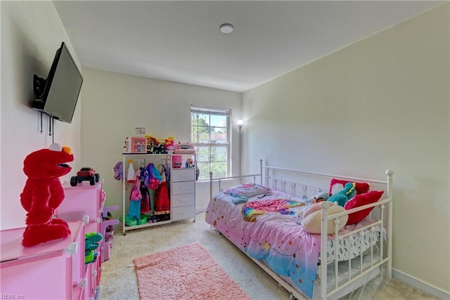 carpeted bedroom with baseboards