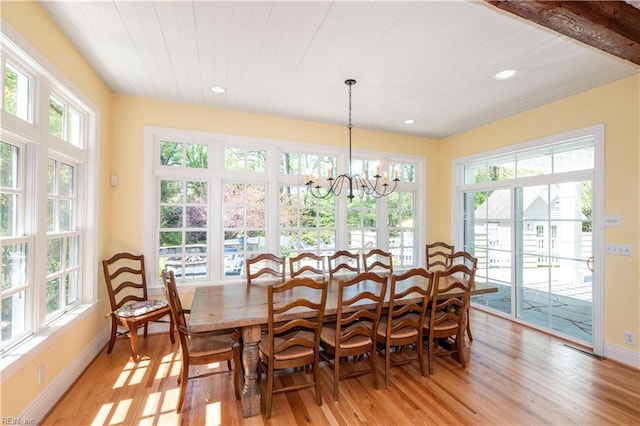 dining area featuring recessed lighting, baseboards, an inviting chandelier, and light wood-type flooring