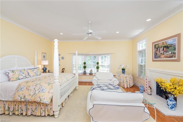 bedroom featuring a ceiling fan, recessed lighting, light wood-style floors, and crown molding