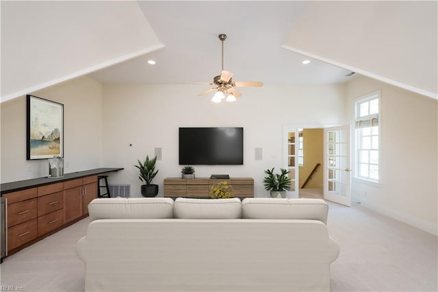 living room with recessed lighting, lofted ceiling, light colored carpet, and ceiling fan