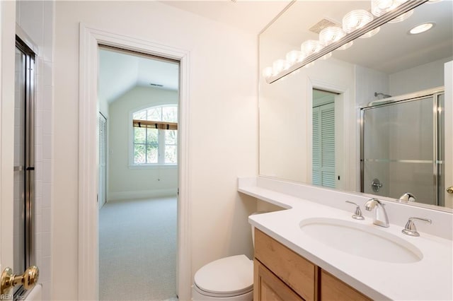 full bathroom with lofted ceiling, an enclosed shower, toilet, vanity, and baseboards