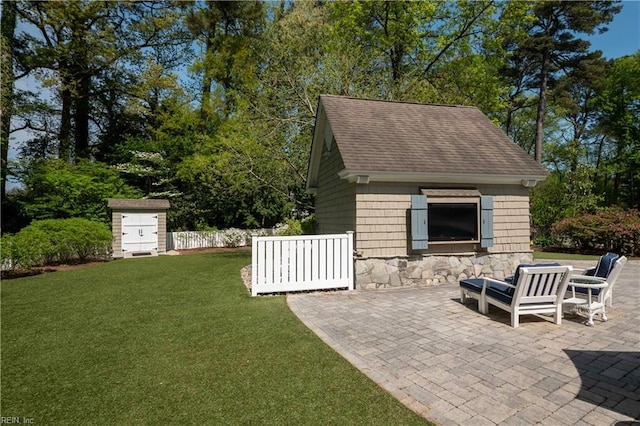 exterior space with an outbuilding and a patio