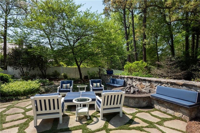 view of patio / terrace with an outdoor hangout area and fence