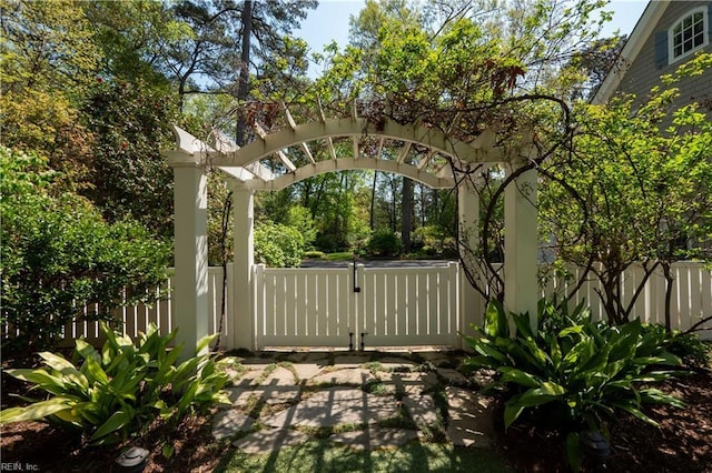 view of gate with fence