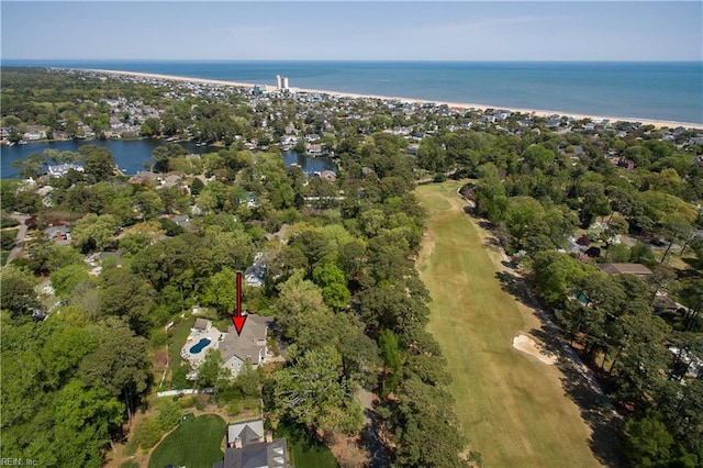 birds eye view of property featuring golf course view and a water view