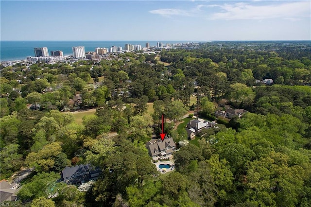 drone / aerial view with a view of trees and a water view