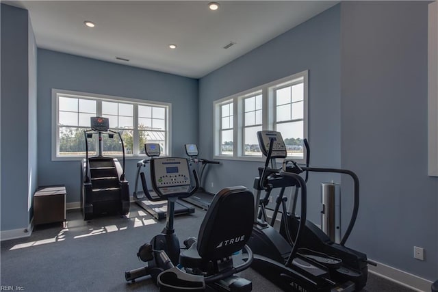 workout room featuring visible vents, baseboards, and recessed lighting